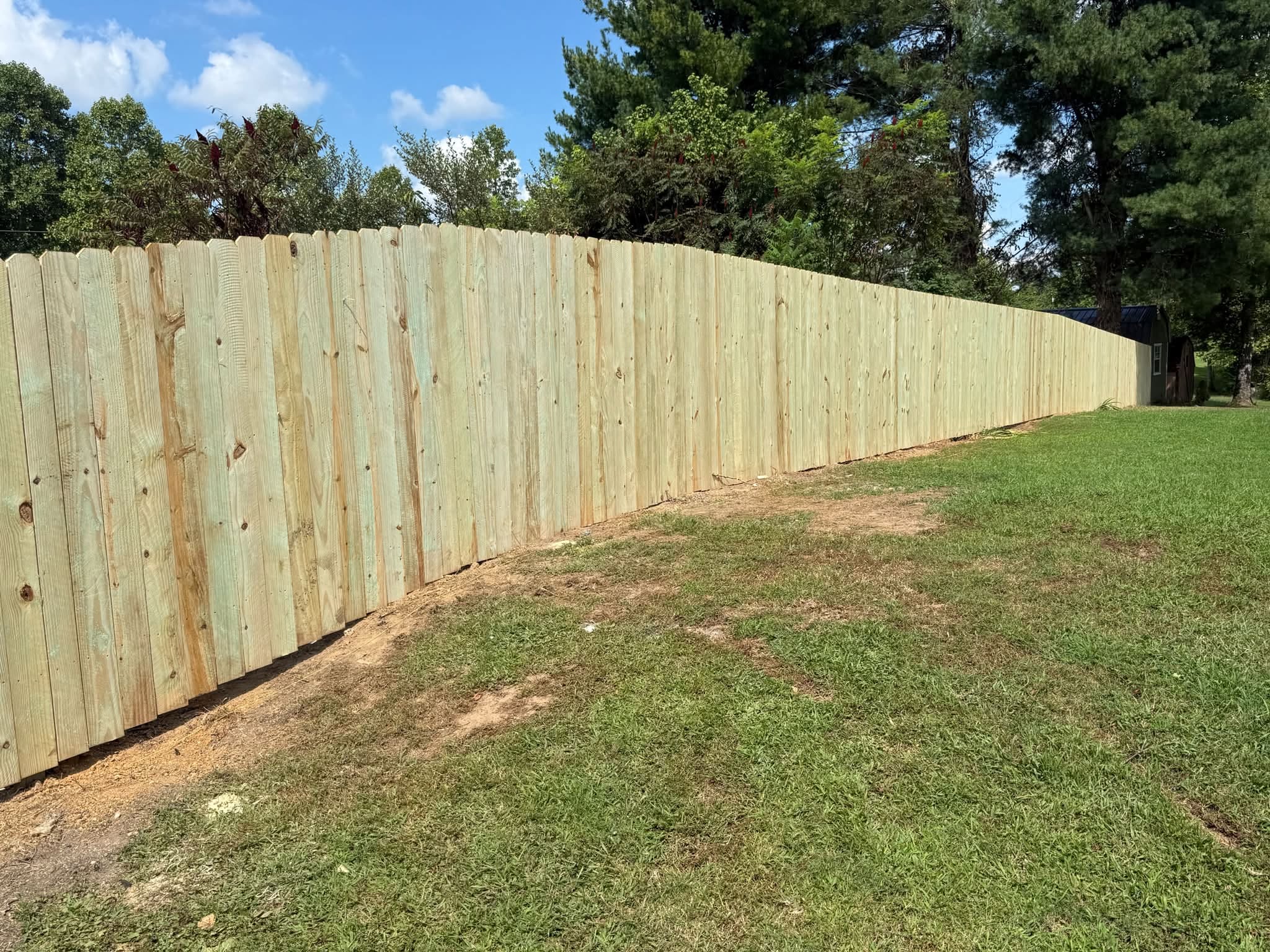 Wood privacy fence in a backyard built by Tennessee Fence Systems